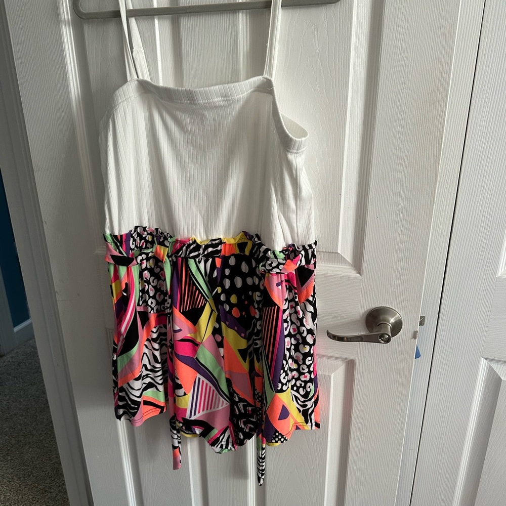 New funky romper, tie in the front and adjustable straps.